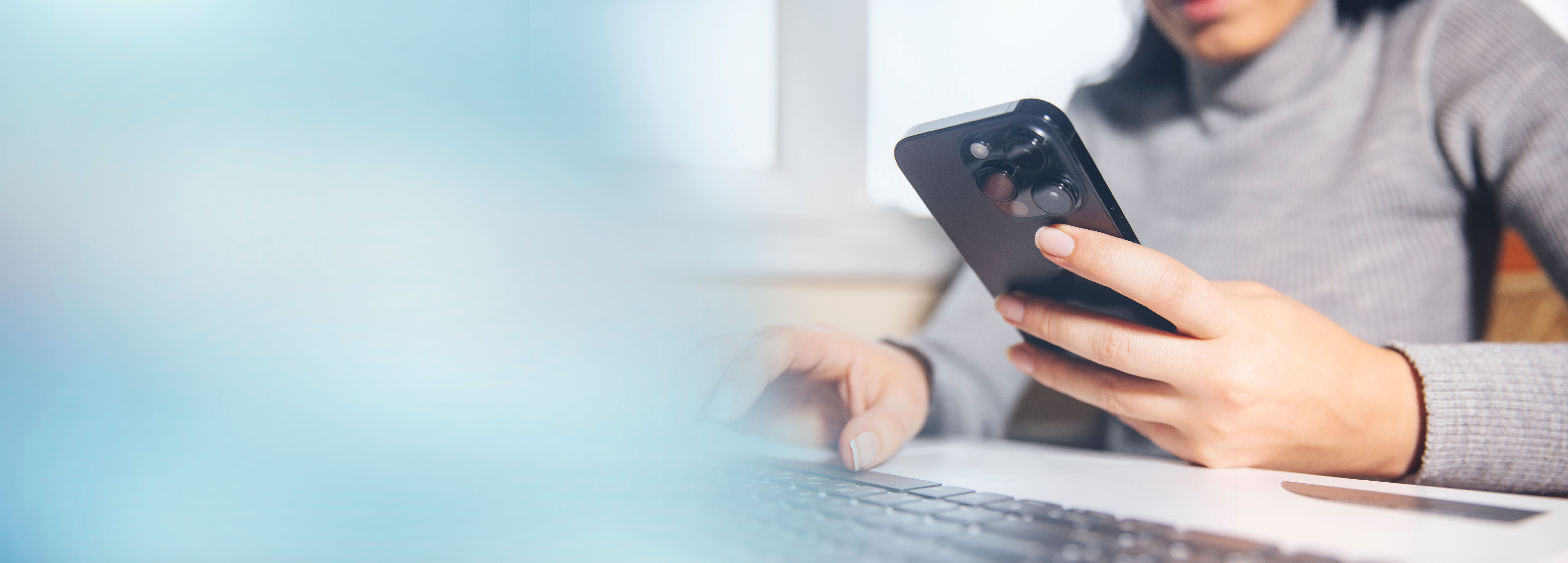 Business woman hands typing on laptop computer keyboard.