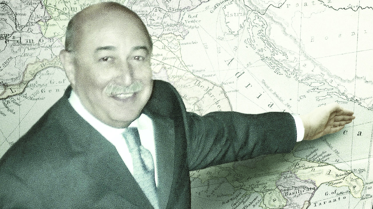 Biagio Bruni, Founder & Chairman, points to a map.