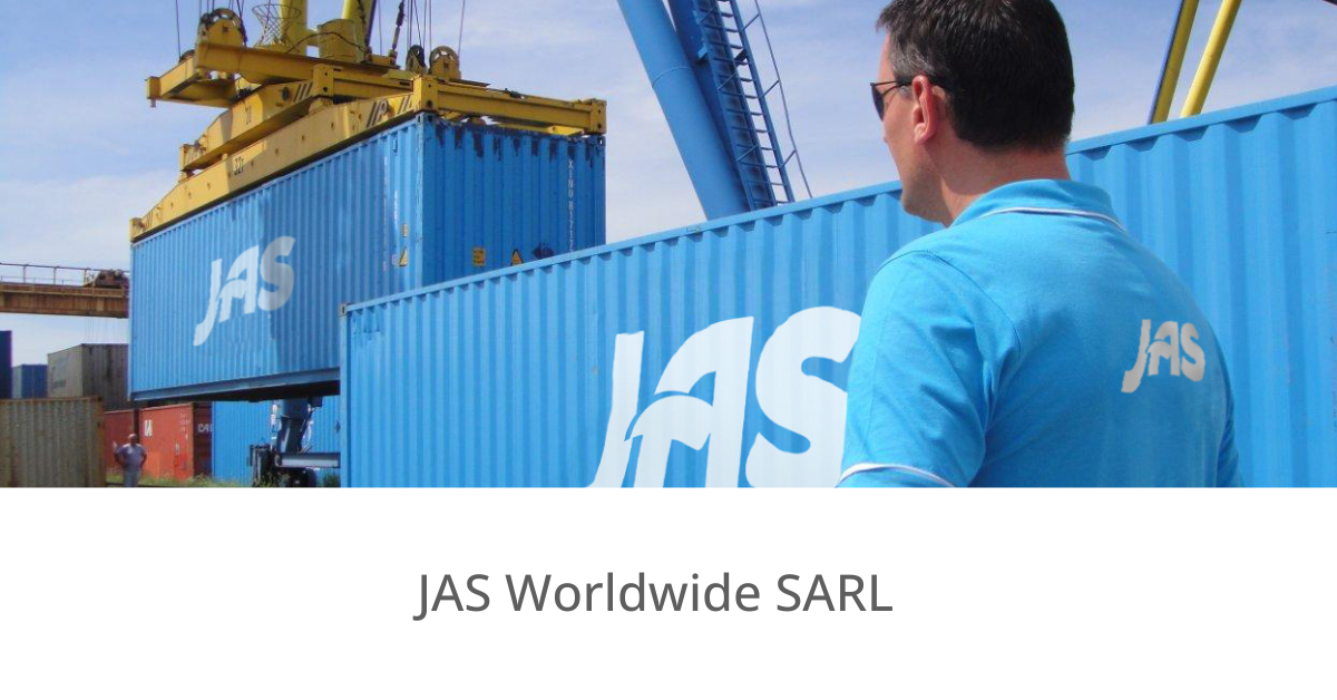 A blue shipping container marked "JAS" being lifted by a crane, with a man in a blue shirt observing.