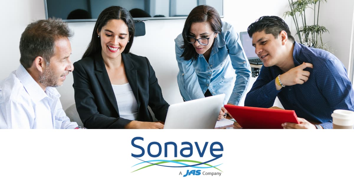 Four people having a meeting around a laptop, with the text "Sonave, A JAS Company" below.